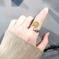 Anillo girasol giratorio